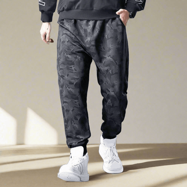 Camouflage drawstring trousers, perfect for a blend of style and utility. Adjustable drawstring waist and durable fabric make these trousers ideal for casual wear and outdoor activities.