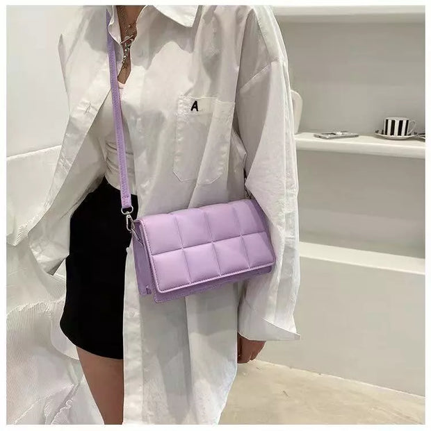 "Minority cross-body bag: Celebrate diversity in style. This chic accessory embraces uniqueness, making a bold fashion statement with every wear."