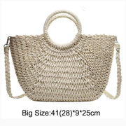 Stylish fancy straw bag with a woven design, colorful tassels, and sturdy leather handles, ideal for fashionable summer outings.