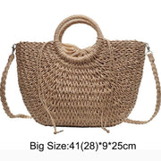 Stylish fancy straw bag with a woven design, colorful tassels, and sturdy leather handles, ideal for fashionable summer outings.