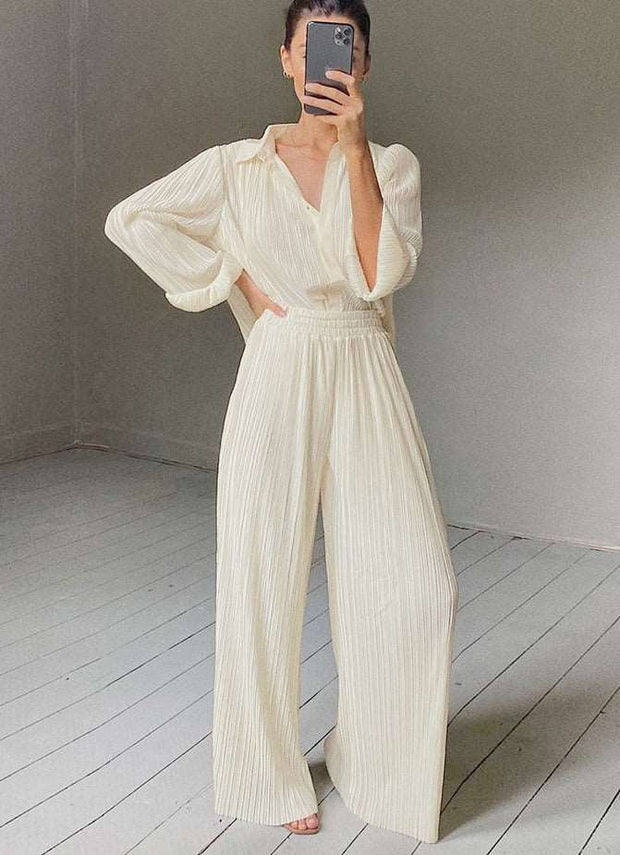 Beige pleated palazzo suit - a chic and sophisticated two-piece ensemble featuring pleated palazzo pants, perfect for timeless elegance and modern style.