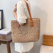 "Bohemian straw bag: Embrace laid-back style with this charming accessory. Perfect for sunny days and eclectic outfits."