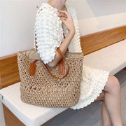 "Bohemian straw bag: Embrace laid-back style with this charming accessory. Perfect for sunny days and eclectic outfits."