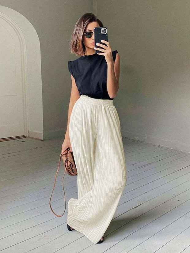 Beige pleated palazzo suit - a chic and sophisticated two-piece ensemble featuring pleated palazzo pants, perfect for timeless elegance and modern style.