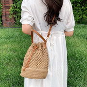 Boho crossbody bag with intricate embroidery, colorful fringe, and adjustable leather strap, perfect for adding a bohemian touch to any outfit.