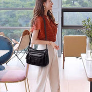 "Multi-pocket shoulder bag: Stay organized on the move with this versatile accessory. Effortlessly stylish, it's perfect for carrying all your essentials in one place."