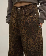 Leopard Print Wide Leg Jeans: Make a statement with these fierce and fashionable wide leg jeans featuring a bold leopard print pattern. Elevate your style with this eye-catching denim essential.