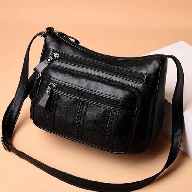 "Multi-pocket shoulder bag: Stay organized on the move with this versatile accessory. Effortlessly stylish, it's perfect for carrying all your essentials in one place."