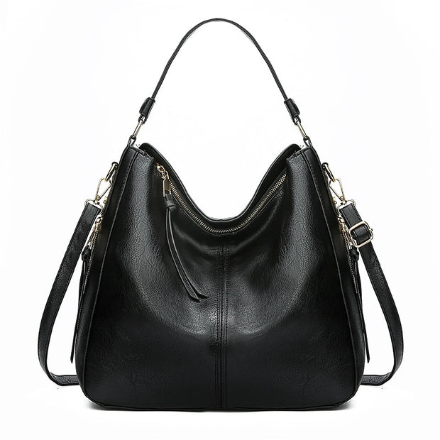 Faux leather vintage messenger handbag, showcasing a timeless design with durable craftsmanship. Perfect for adding a touch of classic elegance to any outfit while providing ample space for your essentials.