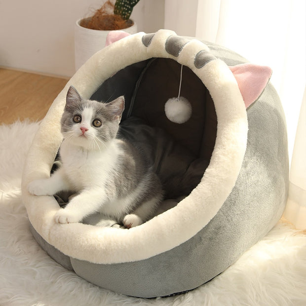 "Warm Cave For Pet: Cozy and insulated pet bed resembling a cave, providing warmth and comfort for cats and small dogs."