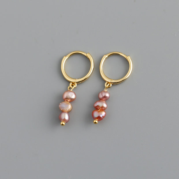 Pearl earrings featuring lustrous pearls set in a variety of elegant designs. Perfect for adding timeless elegance to any ensemble, these earrings are versatile and chic.