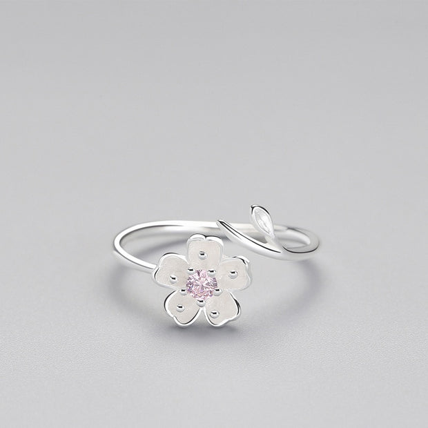 Elevate your style with our 925 Adjustable Flower Ring. Featuring a delicate floral design crafted in sterling silver, it's perfect for adding a touch of elegance to any outfit. Shop now!