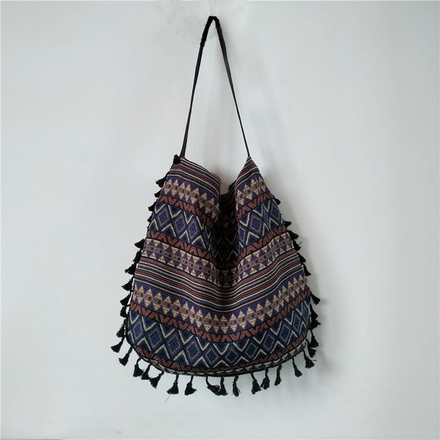 "Bohemian shoulder bag: Embrace free-spirited style with this eclectic accessory. Perfect for adding a touch of wanderlust charm to any outfit."