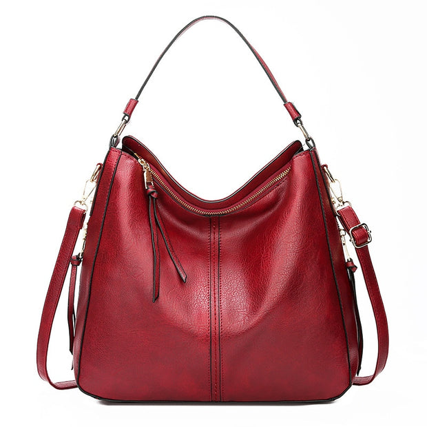 Faux leather vintage messenger handbag, showcasing a timeless design with durable craftsmanship. Perfect for adding a touch of classic elegance to any outfit while providing ample space for your essentials.