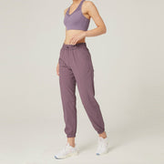 Women's athletic sweatpants featuring a comfortable fit, elastic waistband, and breathable fabric, ideal for workouts, lounging, or casual wear.
