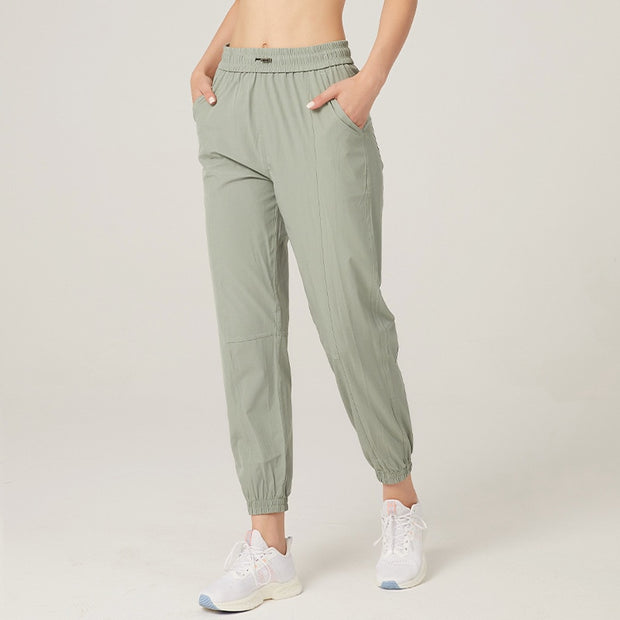 Women's athletic sweatpants featuring a comfortable fit, elastic waistband, and breathable fabric, ideal for workouts, lounging, or casual wear.