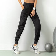 Women's athletic sweatpants featuring a comfortable fit, elastic waistband, and breathable fabric, ideal for workouts, lounging, or casual wear.