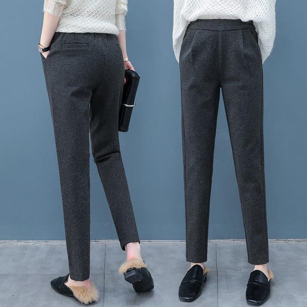 Women's high waist trousers offering a sleek, tailored fit. Versatile and stylish, perfect for casual or formal occasions with a flattering silhouette.