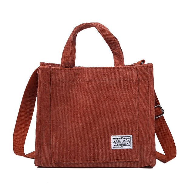 Corduroy shoulder bag, featuring a soft and durable fabric with a stylish design. Perfect for adding a touch of casual elegance to any outfit while providing ample space for your essentials.