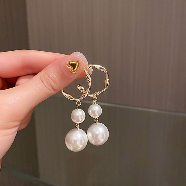 Elegant cross pearl stud earrings, blending classic sophistication with spiritual symbolism. These timeless studs feature lustrous pearls set within delicate cross motifs, adding grace and meaning to your ensemble.