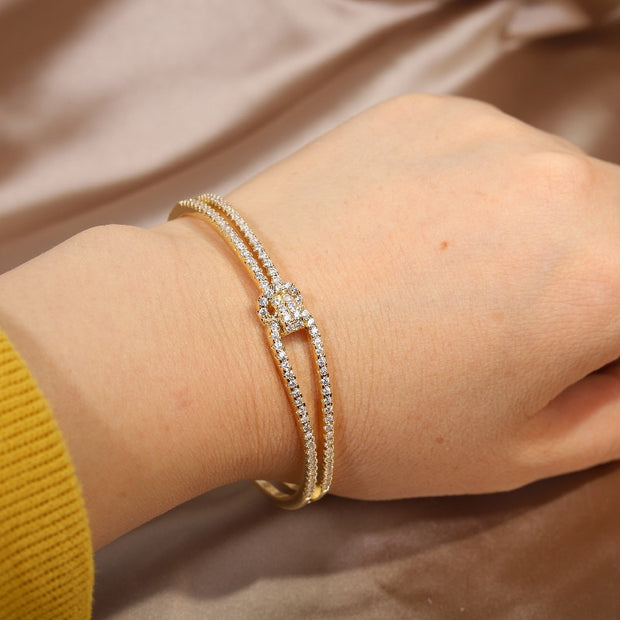 Adjustable bracelet crafted from genuine 14K gold, featuring a sleek and stylish design. Perfect for adding a touch of elegance to any wrist, this bracelet is versatile and timeless.