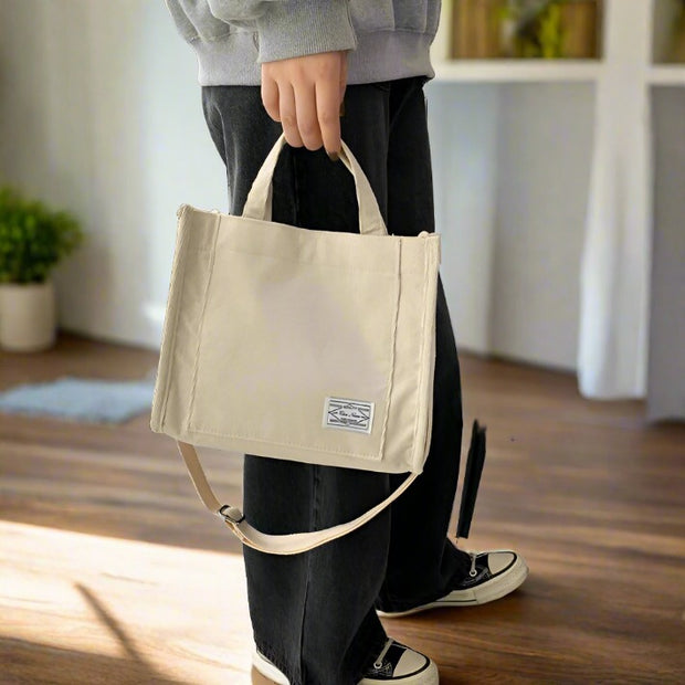 Corduroy shoulder bag, featuring a soft and durable fabric with a stylish design. Perfect for adding a touch of casual elegance to any outfit while providing ample space for your essentials.