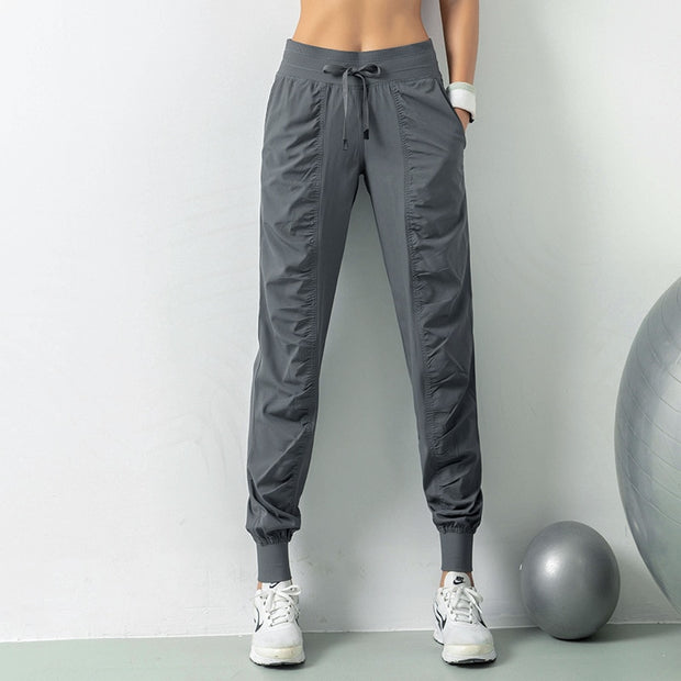 Women's athletic sweatpants featuring a comfortable fit, elastic waistband, and breathable fabric, ideal for workouts, lounging, or casual wear.