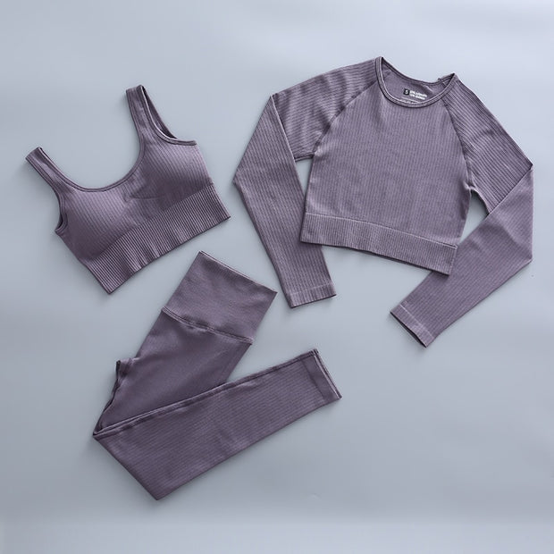 "Stylish women's workout clothes: leggings, sports bras, tank tops, and sneakers. Ideal for fitness and comfort during exercise routines."