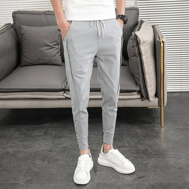 Men's casual harem pants, offering comfort and style for everyday wear. With a relaxed fit and tapered legs, these pants provide a modern twist on casual fashion.