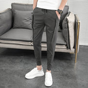 Men's casual harem pants, offering comfort and style for everyday wear. With a relaxed fit and tapered legs, these pants provide a modern twist on casual fashion.