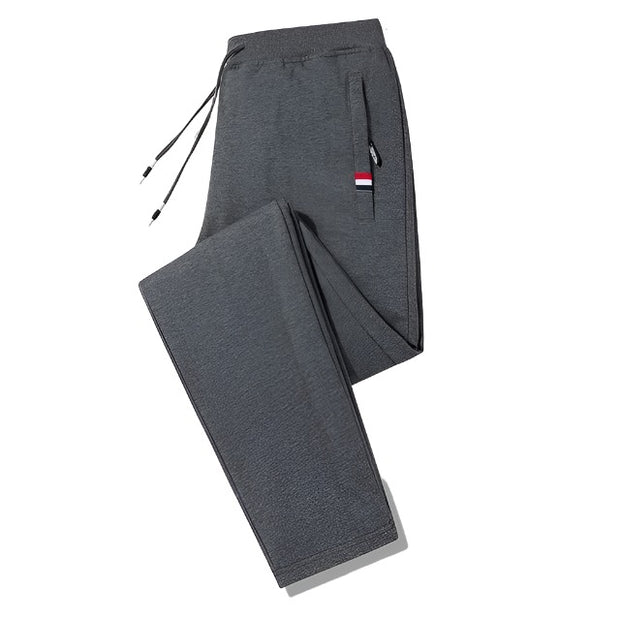 Loose fit men's stretch pants, offering comfort and flexibility for everyday wear. Featuring a relaxed fit and stretchable fabric, these pants are perfect for casual outings and active lifestyles.