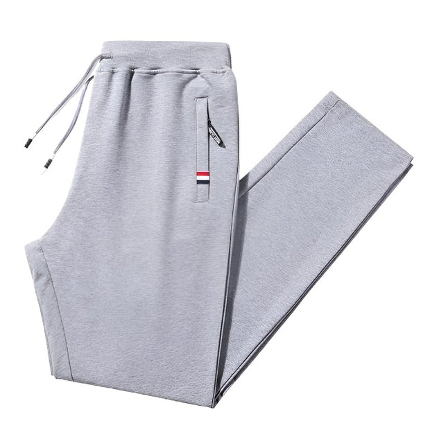 Loose fit men's stretch pants, offering comfort and flexibility for everyday wear. Featuring a relaxed fit and stretchable fabric, these pants are perfect for casual outings and active lifestyles.