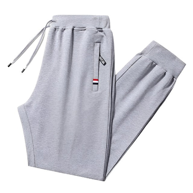 Loose fit men's stretch pants, offering comfort and flexibility for everyday wear. Featuring a relaxed fit and stretchable fabric, these pants are perfect for casual outings and active lifestyles.