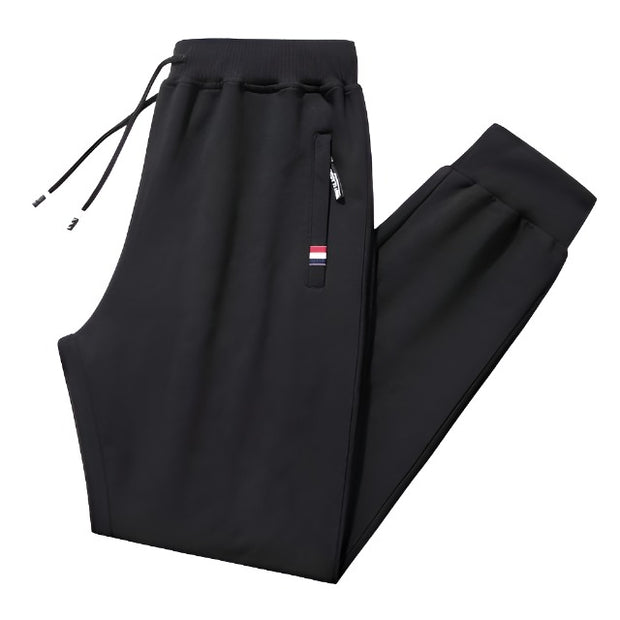 Loose fit men's stretch pants, offering comfort and flexibility for everyday wear. Featuring a relaxed fit and stretchable fabric, these pants are perfect for casual outings and active lifestyles.